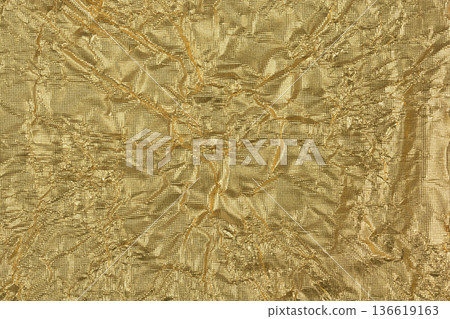 Wrinkled golden foil texture background Wrinkled golden foil texture background 136619163