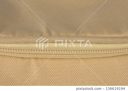 Beige textile material with zipper close up Beige textile material with zipper close up 136619194