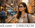 A woman navigates the city with AR glasses 136619236