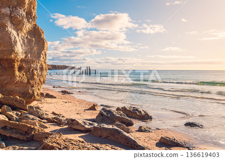 Port Willunga beach with sticks during sunset time Port Willunga beach with sticks during sunset time 136619403