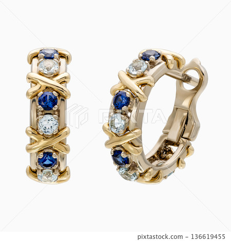 Gold hoop earrings with blue sapphire and aquamarine stones, isolated on white Gold hoop earrings with blue sapphire and aquamarine stones, isolated on white 136619455