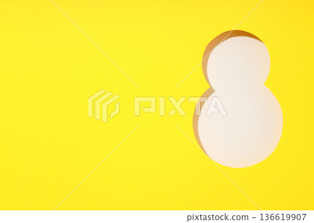 A vibrant yellow background featuring a large white number eight A vibrant yellow background featuring a large white number eight 136619907