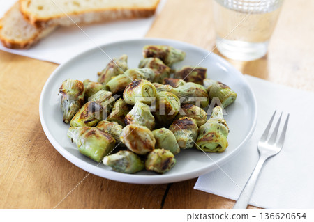 fried baby artichokes on plate fried baby artichokes on plate 136620654