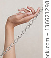 Exquisite silver chain elegantly presented against subtle beige backdrop for catalog imagery 136621298
