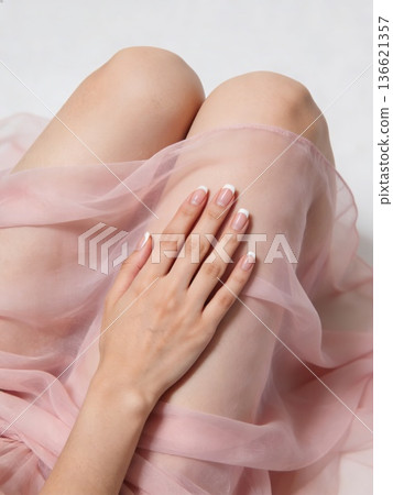 An enchanting lady radiating elegance through her delicate dress and poised demeanor 136621357