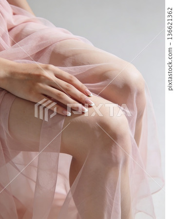 An enchanting lady radiating elegance through her delicate dress and poised demeanor 136621362