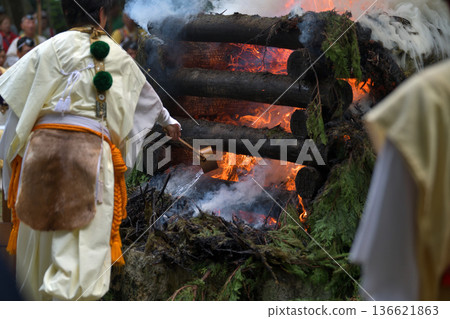 Choito Daigoma Shugendo adjusts the force of the flame by sprinkling water on it Choito Daigoma Shugendo adjusts the force of the flame by sprinkling water on it 136621863
