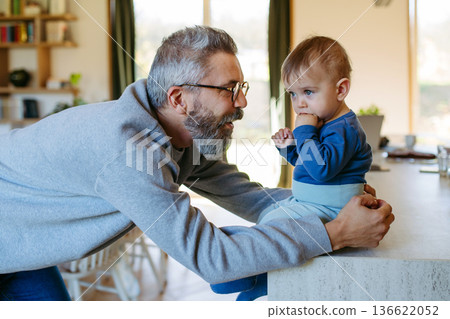Father with little toddler son at home. Father with little toddler son at home. 136622052