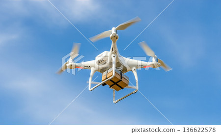 white drone flying in blue sky delivering cardboard package box fast shipping service logistics transport technology concept innovation air mail unmanned vehicle future 136622578