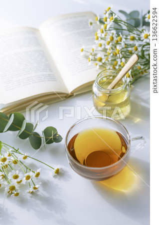 Reading time with Earl Grey tea, honey, matricaria and eucalyptus 136622594