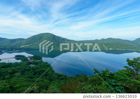 Lake Onuma and the mountain range seen from the Mount Akagi hiking trail. A tranquil lakescape in Gunma Prefecture. 136623010