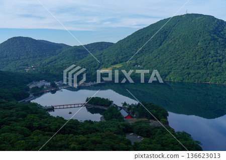 Lake Onuma and the mountain range seen from the Mount Akagi hiking trail. A tranquil lakescape in Gunma Prefecture. 136623013
