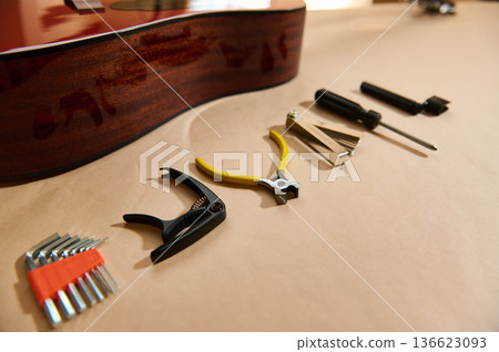 Guitar String Maintenance And Repair Tools Laid Out For Adjustment Guitar String Maintenance And Repair Tools Laid Out For Adjustment 136623093