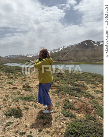Woman mountain lake. Woman mountain landscape. High quality photo Woman mountain lake. Woman mountain landscape. High quality photo 136623151