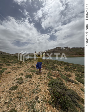 Woman mountain lake. Woman mountain landscape. High quality photo Woman mountain lake. Woman mountain landscape. High quality photo 136623155
