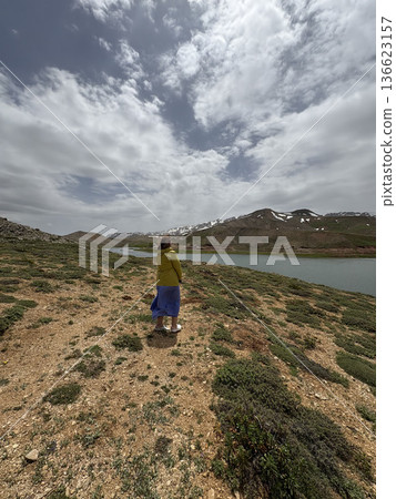 Woman mountain lake. Woman mountain landscape. High quality photo Woman mountain lake. Woman mountain landscape. High quality photo 136623157