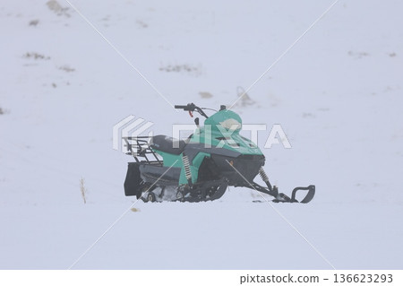 Snowy snowmobile solitude. High quality photo Snowy snowmobile solitude. High quality photo 136623293