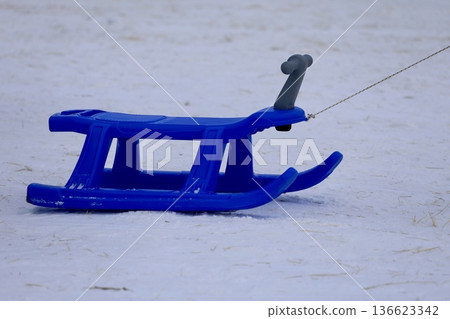 Blue plastic sled. High quality photo Blue plastic sled. High quality photo 136623342