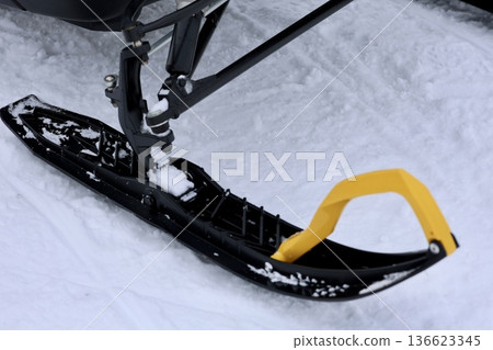 Snow-covered snowmobile tracks. High quality photo Snow-covered snowmobile tracks. High quality photo 136623345