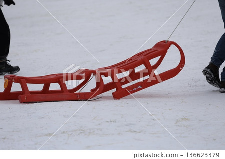 Person pulling sled. High quality photo Person pulling sled. High quality photo 136623379