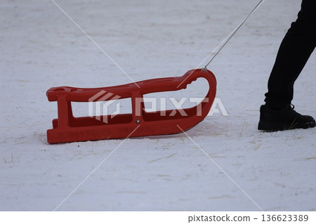 Person pulling sled. High quality photo 136623389