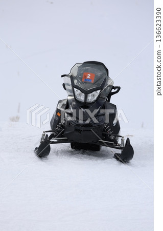 Snowmobiles winter landscape Snowy snowmobile solitude. High quality photo Snowmobiles winter landscape Snowy snowmobile solitude. High quality photo 136623390