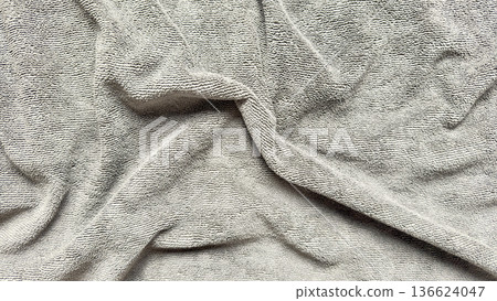 soft gray terry cloth texture with elegant folds creating serene neutral backdrop for wallpaper or minimalist banner copy space soft gray terry cloth texture with elegant folds creating serene neutral backdrop for wallpaper or minimalist banner copy space 136624047