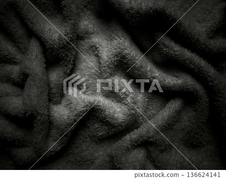abstract black fur texture undulating in dramatic waves with soft shadows and intricate folds perfect for moody wallpaper or atmospheric commercial background 136624141