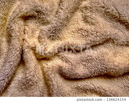 soft beige fleece texture undulates in gentle folds with warm glow for cozy wallpaper or fabric banner background soft beige fleece texture undulates in gentle folds with warm glow for cozy wallpaper or fabric banner background 136624154