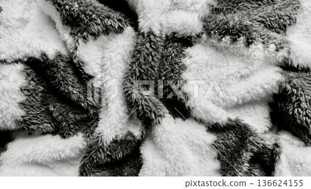 abstract monochrome fluffy fur texture closeup with swirling black white patterns evoking cozy elegance ideal for wallpaper or banner background abstract monochrome fluffy fur texture closeup with swirling black white patterns evoking cozy elegance ideal for wallpaper or banner background 136624155