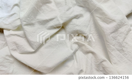 elegant wrinkled white linen folds in macro view capturing subtle shadows and textures perfect for serene desktop wallpaper or versatile design backdrop elegant wrinkled white linen folds in macro view capturing subtle shadows and textures perfect for serene desktop wallpaper or versatile design backdrop 136624156