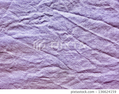 lavender crumpled fabric texture closeup with soft violet folds and creases evoking calm serenity for wallpaper background or copy space banner 136624159