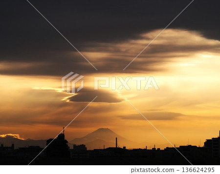 Orange evening sky and the silhouette of Mt. Fuji 136624295