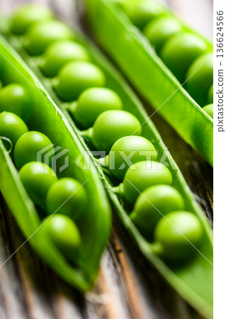 Close up of green peas inside pods as natural food ingredient 136624566