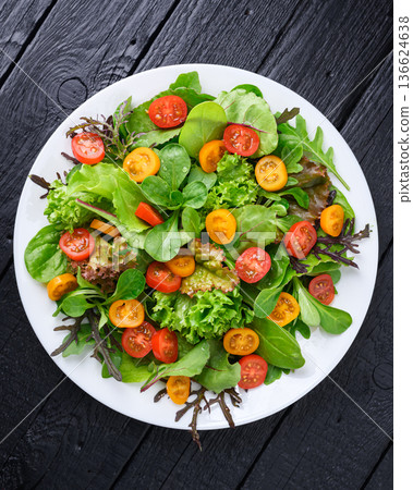 Mixed salad greens with cherry tomatoes Mixed salad greens with cherry tomatoes 136624638