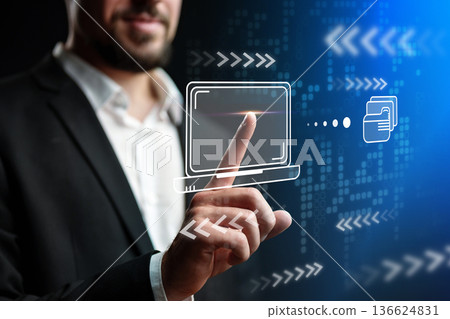 Man interacts with digital interface showing technology and data transfer in a modern setting Man interacts with digital interface showing technology and data transfer in a modern setting 136624831
