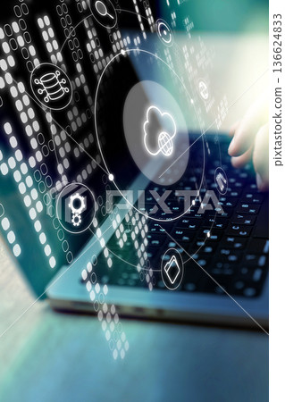 Data management and cloud computing in a busy work environment with a laptop Data management and cloud computing in a busy work environment with a laptop 136624833