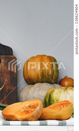 Autumn harvest display with pumpkins and squash on a wooden table Autumn harvest display with pumpkins and squash on a wooden table 136624904