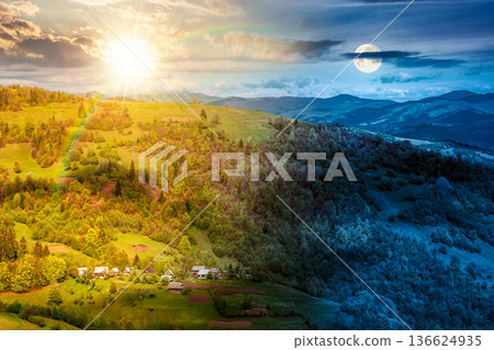 rural area in mountain landscape. day and night time change concept. village on a steep green hill with sun and moon during spring. alpine countryside scenery in dappled light rural area in mountain landscape. day and night time change concept. village on a steep green hill with sun and moon during spring. alpine countryside scenery in dappled light 136624935