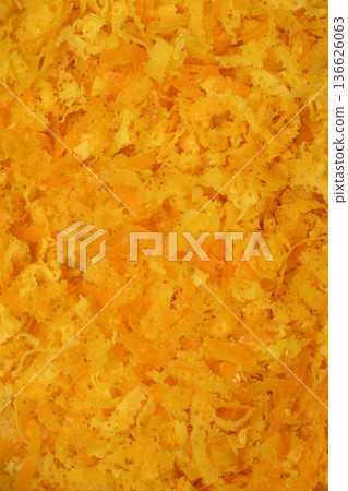 Grated orange zest texture background Grated orange zest texture background 136626063
