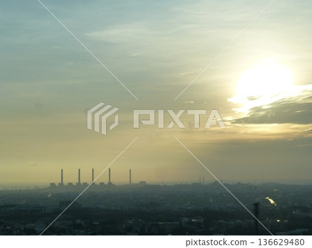 Taichung, Taiwan - 08. Taichung, Taiwan - 08.07.07.2017: A distant view of the Taichung Power Plant on the Qingping Plain along the Taichung coastline at dusk. Taichung, Taiwan - 08. Taichung, Taiwan - 08.07.07.2017: A distant view of the Taichung Power Plant on the Qingping Plain along the Taichung coastline at dusk. 136629480