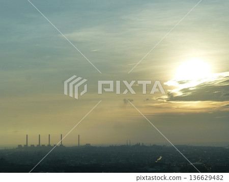 Taichung, Taiwan - 08. Taichung, Taiwan - 08.07.07.2017: A distant view of the Taichung Power Plant on the Qingping Plain along the Taichung coastline at dusk. Taichung, Taiwan - 08. Taichung, Taiwan - 08.07.07.2017: A distant view of the Taichung Power Plant on the Qingping Plain along the Taichung coastline at dusk. 136629482