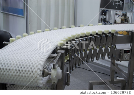 Modular belt rotary conveyor. Continuous movement system. Transportation of materials or products. Conveyors for moving objects. Production manufacture. Moving industrial belt. Connected plastic links Modular belt rotary conveyor. Continuous movement system. Transportation of materials or products. Conveyors for moving objects. Production manufacture. Moving industrial belt. Connected plastic links 136629788
