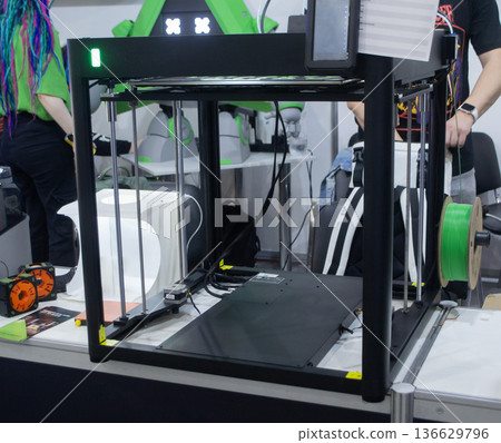 3D printer. 3D printer with a blank build surface. Open 3D printer. 3D printer with an empty work surface. Concept printing technology. Additive progressive FDM technologies 136629796