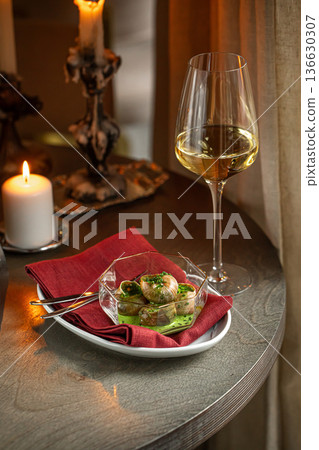 Escargot snails with garlic herb butter Escargot snails with garlic herb butter 136630307