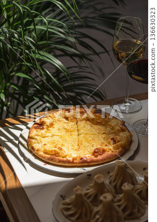 Traditional Georgian khachapuri with melted cheese Traditional Georgian khachapuri with melted cheese 136630323