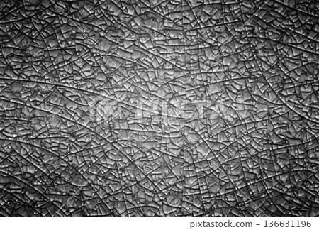 Black metal background with abstract cracks. Black metal background with abstract cracks. 136631196