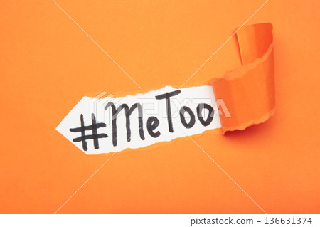 Internet protest hashtag MeToo on ripped orange paper, used for campaign against sexual violence and abuse of women Internet protest hashtag MeToo on ripped orange paper, used for campaign against sexual violence and abuse of women 136631374