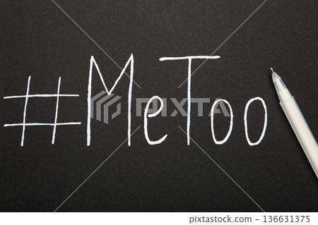 Hashtag METOO inscription white pen on black background Hashtag METOO inscription white pen on black background 136631375