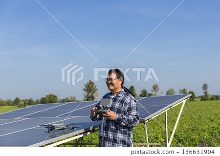 Modern Technologies in Agriculture.  Farmer with drone on the farm field. Smart farming and precision agriculture.  136631904